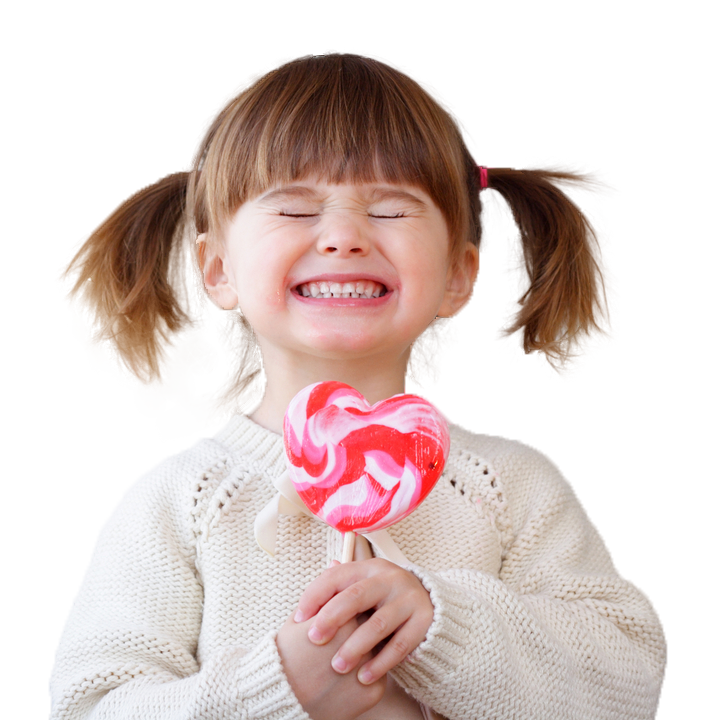 Young girl smiling with lollipop