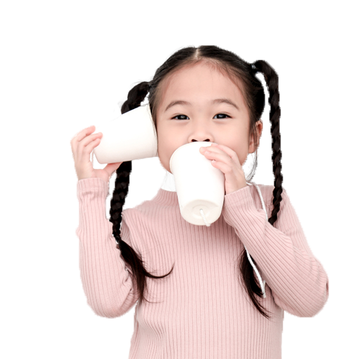 Girl with paper cup and string to ear and mouth