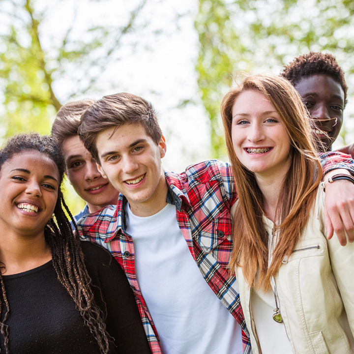 diverse group of teens smiling